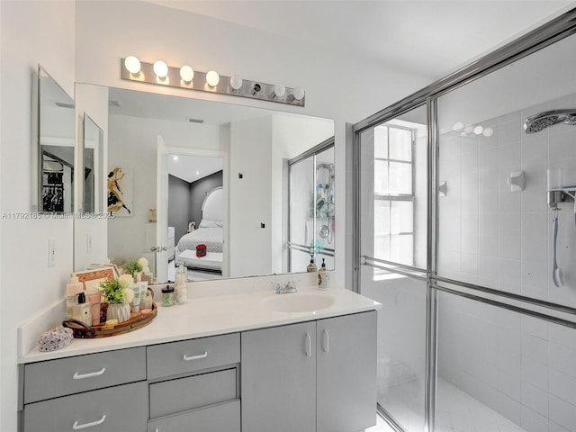 full bath featuring vanity, ensuite bathroom, and a stall shower