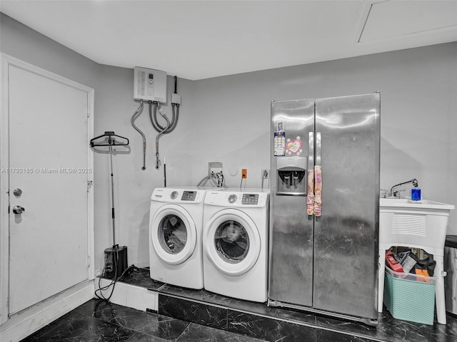 washroom featuring marble finish floor and independent washer and dryer
