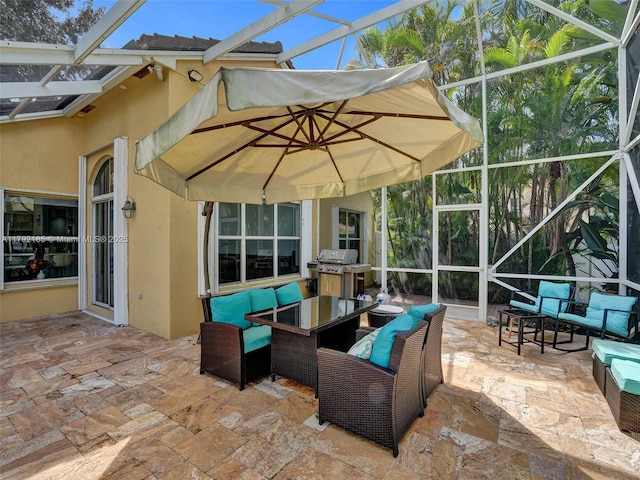 view of patio / terrace featuring grilling area, an outdoor living space, and a lanai