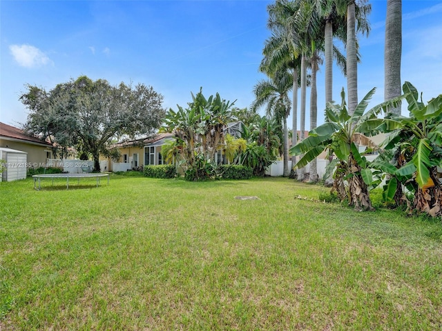 10937 NW 46th Dr, Coral Springs, FL 33076 - view of yard with a trampoline