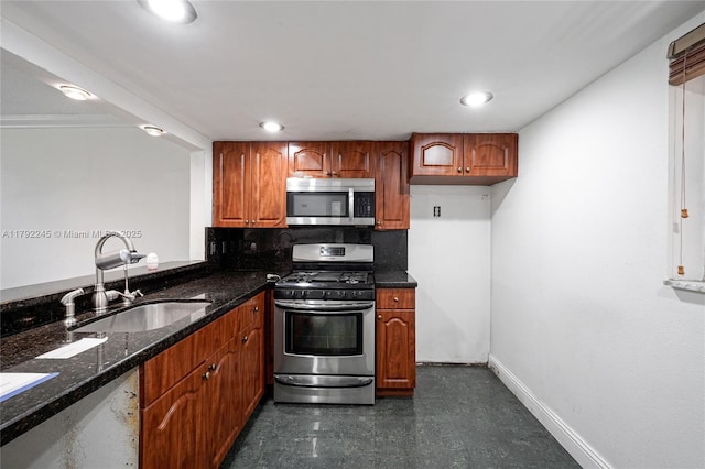 17911 NW 68th Ave Unit P208, Hialeah, FL 33015 - kitchen featuring dark stone counters, brown cabinetry, appliances with stainless steel finishes, and a sink
