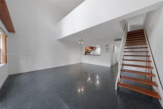 17911 NW 68th Ave Unit P208, Hialeah, FL 33015 - stairs featuring visible vents, baseboards, and a high ceiling