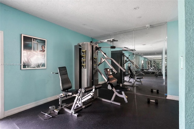 17911 NW 68th Ave Unit P208, Hialeah, FL 33015 - exercise room featuring a textured ceiling