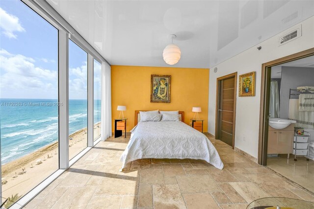 1830 S Ocean Dr Unit 1201, Hallandale Beach, FL 33009 - bedroom featuring access to outside, baseboards, a water view, visible vents, and stone tile flooring