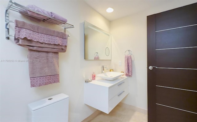 1830 S Ocean Dr Unit 1201, Hallandale Beach, FL 33009 - bathroom featuring toilet, baseboards, tile patterned flooring, and vanity
