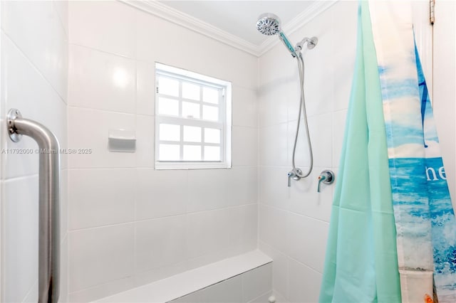 bathroom featuring ornamental molding and a tile shower