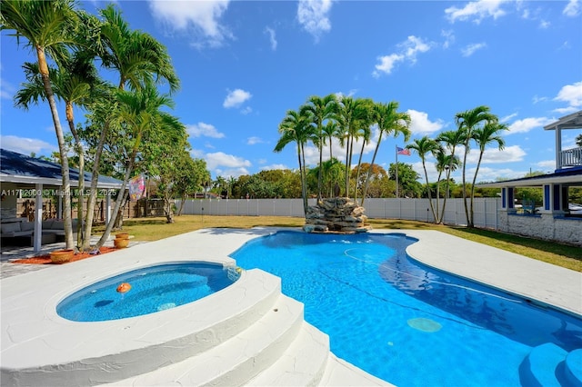view of swimming pool featuring an outdoor living space, a fenced backyard, a gazebo, a pool with connected hot tub, and a patio area