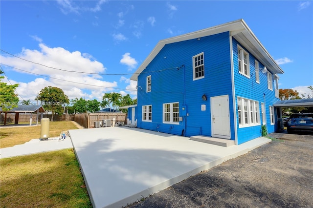 exterior space with fence and driveway