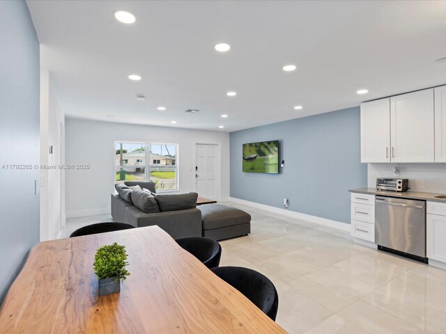 dining room with recessed lighting, light tile patterned floors, visible vents, baseboards, and a toaster