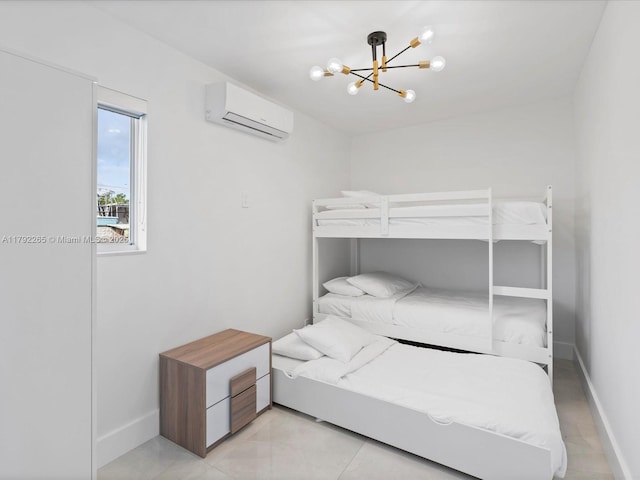 bedroom featuring an AC wall unit, a notable chandelier, and baseboards