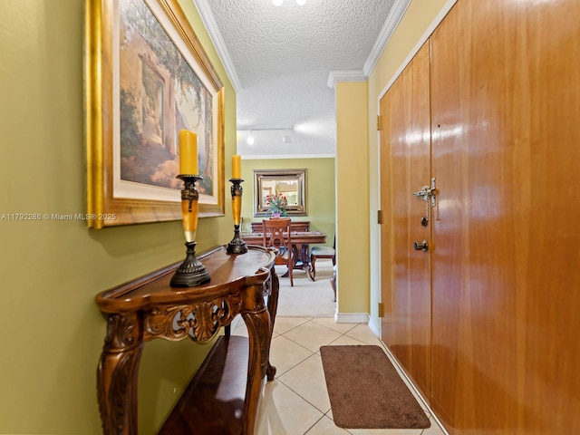 1300 SW 122nd Ave Unit 303-2, Miami, FL 33184 - hallway with a textured ceiling, light tile patterned floors, and crown molding