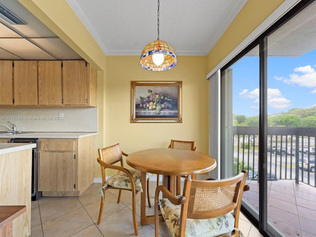 1300 SW 122nd Ave Unit 303-2, Miami, FL 33184 - dining room featuring light tile patterned floors, crown molding, and a textured ceiling