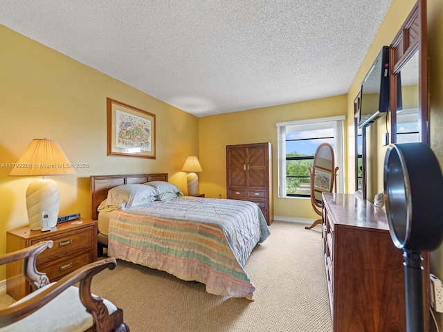 1300 SW 122nd Ave Unit 303-2, Miami, FL 33184 - bedroom featuring light colored carpet, a textured ceiling, and baseboards