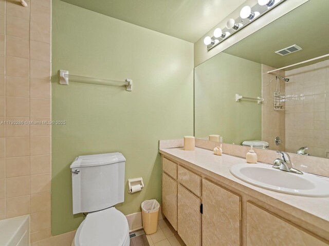1300 SW 122nd Ave Unit 303-2, Miami, FL 33184 - bathroom with toilet, tile patterned floors, vanity, and bathing tub / shower combination
