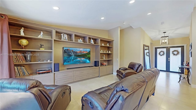 living area featuring french doors, recessed lighting, built in features, and vaulted ceiling