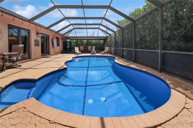 view of pool featuring a patio, a fenced in pool, and a lanai