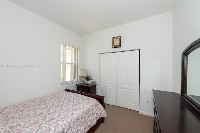 bedroom with a closet and carpet floors