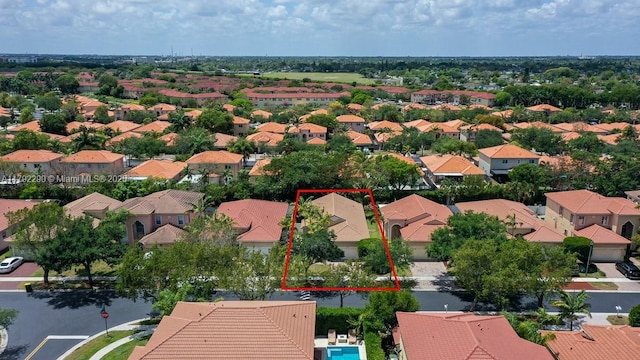 birds eye view of property with a residential view