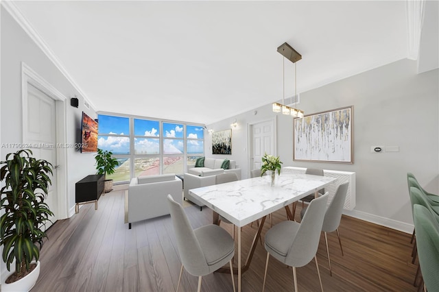50 Biscayne Blvd Unit 4004, Miami, FL 33132 - dining room with ornamental molding, a notable chandelier, baseboards, and dark wood finished floors