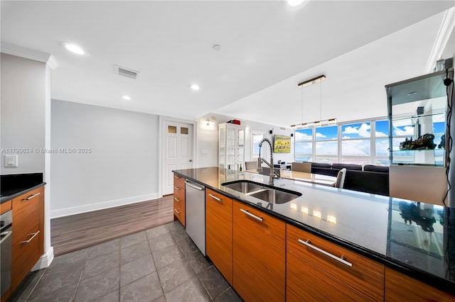50 Biscayne Blvd Unit 4004, Miami, FL 33132 - kitchen featuring stainless steel dishwasher, dark tile patterned flooring, brown cabinets, a sink, and visible vents