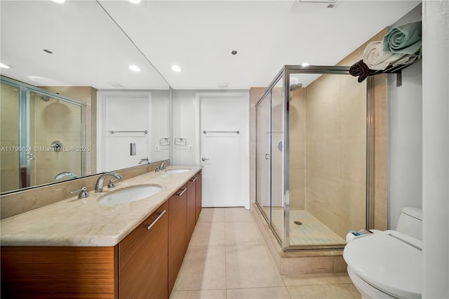 50 Biscayne Blvd Unit 4004, Miami, FL 33132 - full bath with tile patterned floors, double vanity, toilet, a sink, and a stall shower