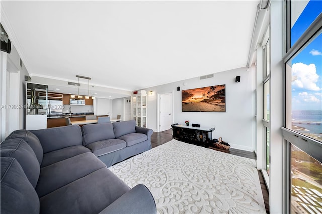 50 Biscayne Blvd Unit 4004, Miami, FL 33132 - living area featuring wood finished floors, visible vents, crown molding, and baseboards