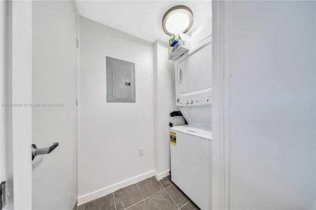50 Biscayne Blvd Unit 4004, Miami, FL 33132 - laundry room with stacked washer / drying machine, electric panel, baseboards, dark tile patterned floors, and laundry area