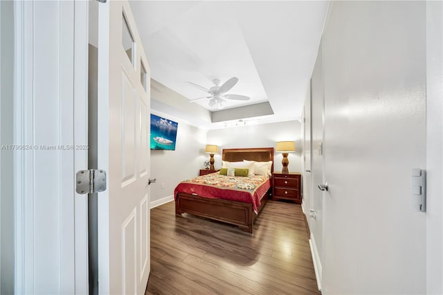 50 Biscayne Blvd Unit 4004, Miami, FL 33132 - bedroom with baseboards, wood finished floors, ceiling fan, and a tray ceiling