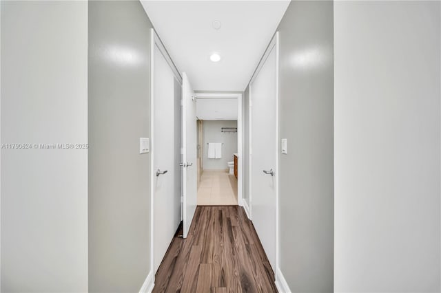 50 Biscayne Blvd Unit 4004, Miami, FL 33132 - corridor featuring dark wood-style floors and baseboards