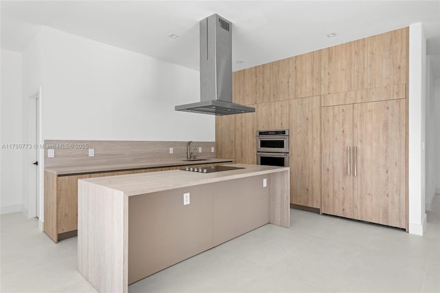 19601 E Saint Andrews Dr, Hialeah, FL 33015 - kitchen with a sink, a kitchen island, black electric cooktop, island exhaust hood, and modern cabinets