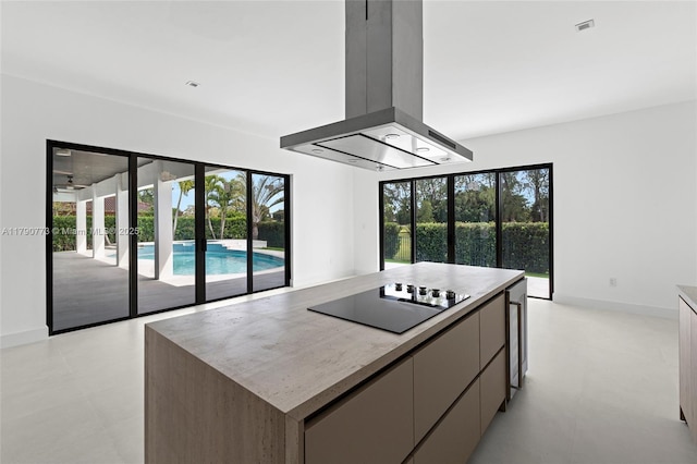19601 E Saint Andrews Dr, Hialeah, FL 33015 - kitchen featuring a center island, island exhaust hood, modern cabinets, and black electric cooktop