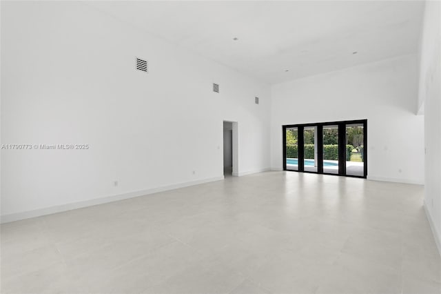 19601 E Saint Andrews Dr, Hialeah, FL 33015 - unfurnished room with visible vents, baseboards, and a high ceiling