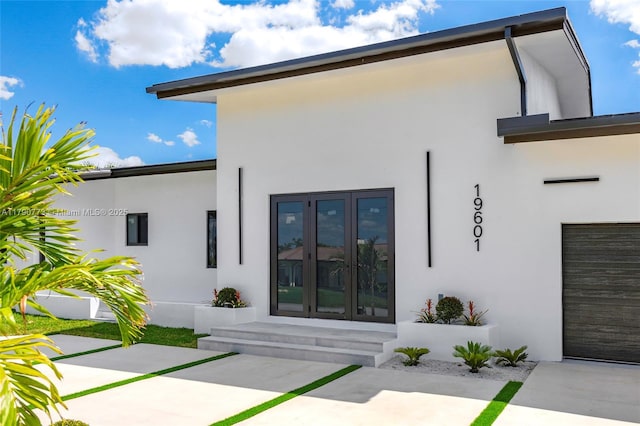 19601 E Saint Andrews Dr, Hialeah, FL 33015 - back of property featuring french doors and stucco siding