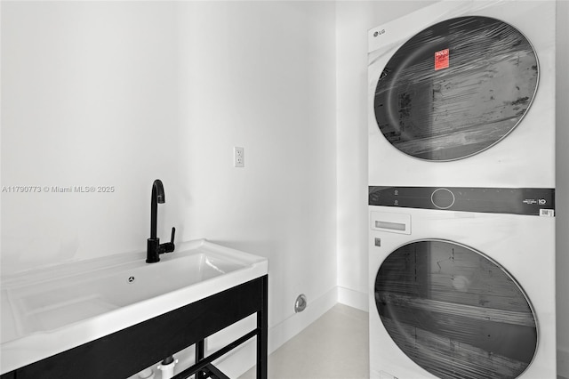 19601 E Saint Andrews Dr, Hialeah, FL 33015 - laundry room featuring a sink, stacked washer and clothes dryer, and laundry area