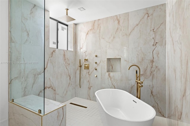 19601 E Saint Andrews Dr, Hialeah, FL 33015 - bathroom with a marble finish shower, tile walls, and a freestanding tub