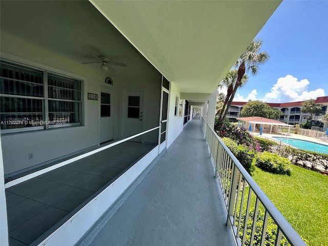 balcony featuring ceiling fan