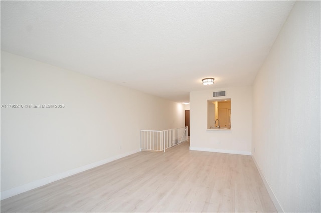 9210 Fontainebleau Blvd Unit 505, Miami, FL 33172 - unfurnished room with light wood-style floors, baseboards, and a sink