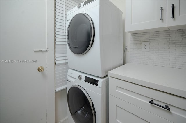 9210 Fontainebleau Blvd Unit 505, Miami, FL 33172 - washroom with stacked washer / dryer and cabinet space