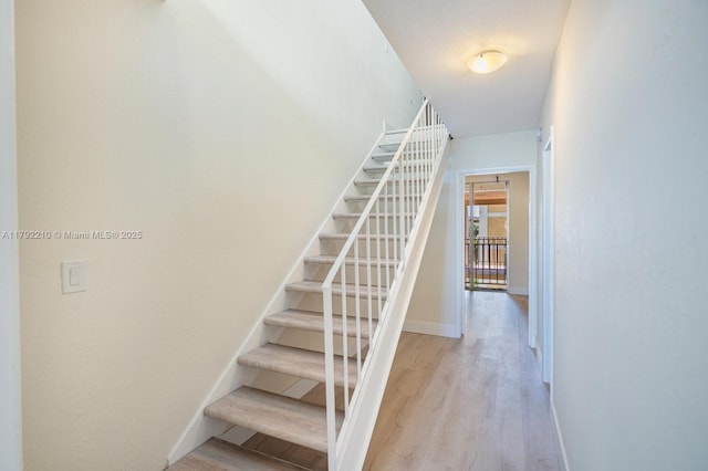9210 Fontainebleau Blvd Unit 505, Miami, FL 33172 - stairway with wood finished floors and baseboards