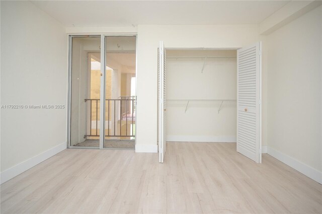 9210 Fontainebleau Blvd Unit 505, Miami, FL 33172 - unfurnished bedroom featuring wood finished floors and baseboards
