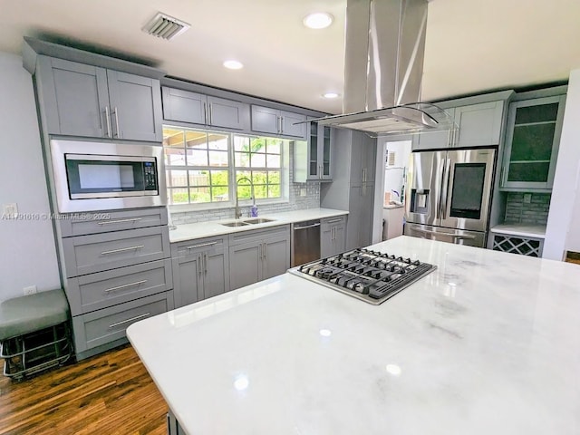 7431 SW 135th Ave, Miami, FL 33183 - kitchen featuring visible vents, island range hood, gray cabinets, a sink, and appliances with stainless steel finishes