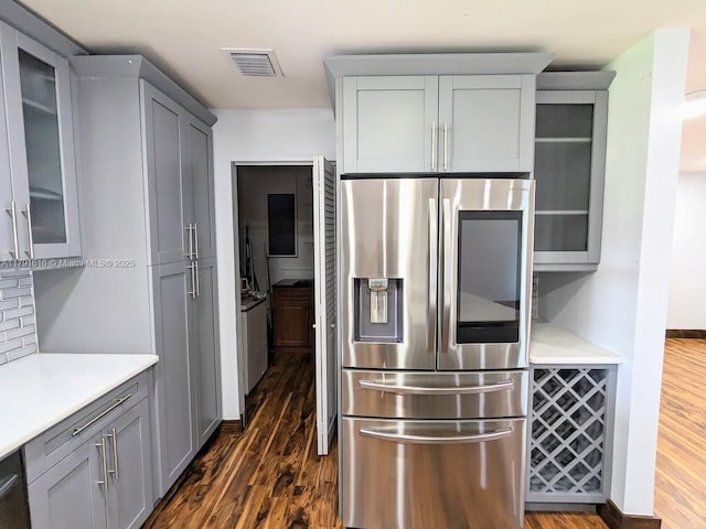 7431 SW 135th Ave, Miami, FL 33183 - kitchen with light countertops, visible vents, stainless steel fridge, and dark wood finished floors