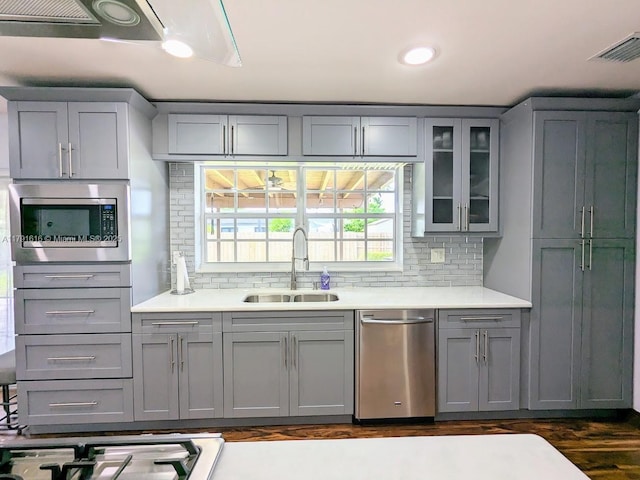 7431 SW 135th Ave, Miami, FL 33183 - kitchen with a sink, light countertops, gray cabinetry, and stainless steel appliances
