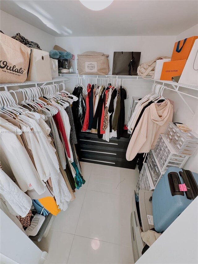 walk in closet featuring tile patterned flooring