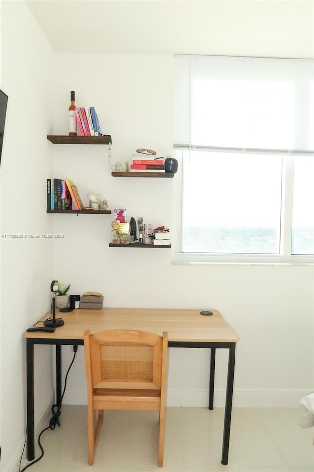 interior space with baseboards