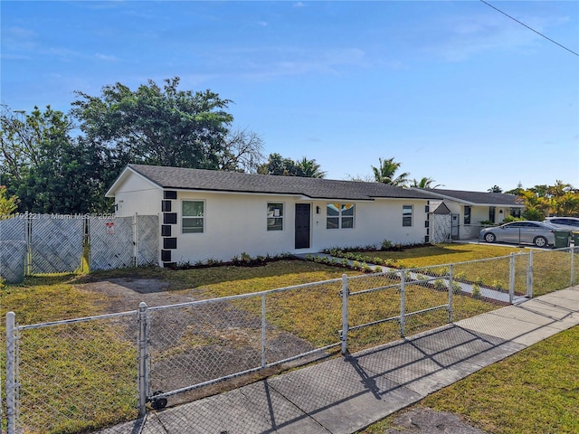 single story home featuring a gate, a fenced front yard, stucco siding, and a front yard