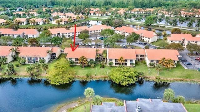 drone / aerial view with a water view