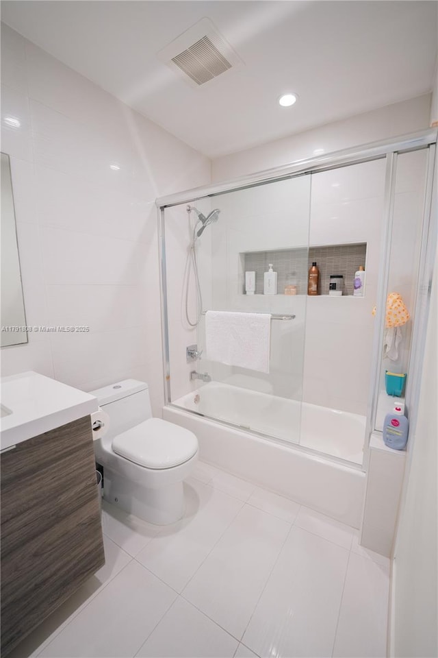 3891 SW 147th Ave Unit 13, Miami, FL 33185 - bathroom with combined bath / shower with glass door, visible vents, toilet, vanity, and tile patterned flooring
