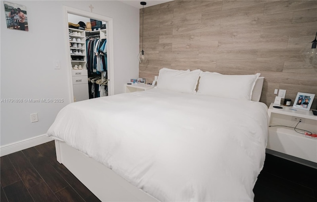 3891 SW 147th Ave Unit 13, Miami, FL 33185 - bedroom featuring baseboards, dark wood-type flooring, a walk in closet, and a closet
