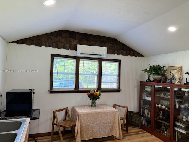 3725 SW 162nd St, Gainesville, FL 32618 - dining room featuring a wall mounted air conditioner, wood finished floors, lofted ceiling, and recessed lighting